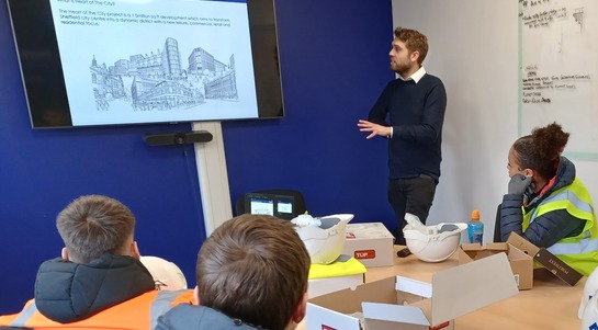 Volunteer in a session with a school