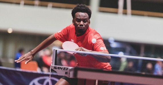 British Para Table Tennis athlete Ashley Facey hitting the table tennis ball with his paddle