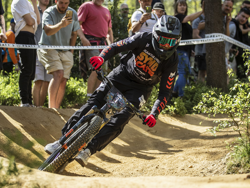 Dirt bike rider racing down the track 