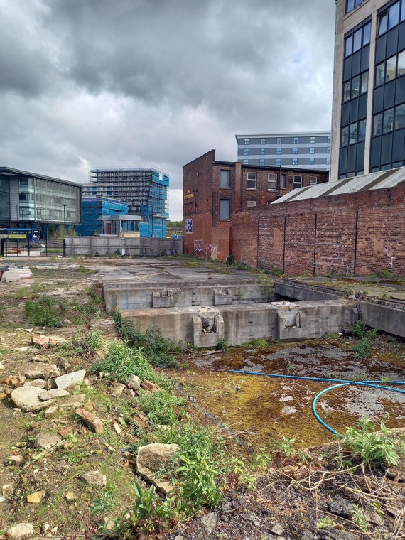 Among the rubble of the castle site development lies the River Sheaf, covered by concrete