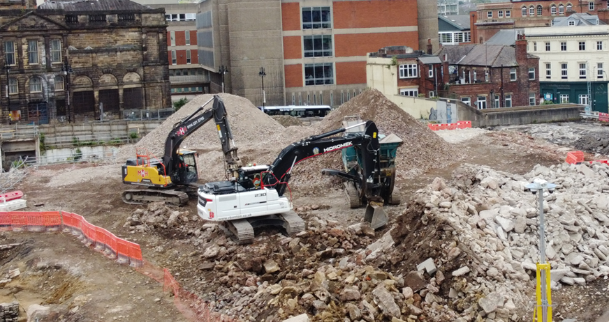 Heavy machinery working through the rubble at the Sheffield Castle site