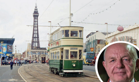 An image of Blackpool promenade. There is a tram in the foreground and the Tower is visible in the background.