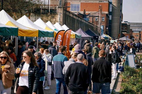 The stalls of Pollen Market are busy with crowds of people