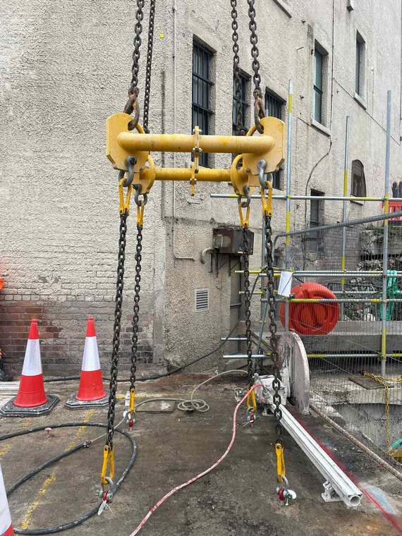 A crane prepares to lift a section of slab from the River Sheaf culvert