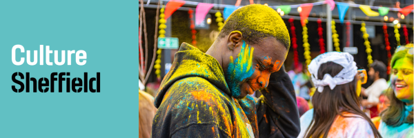 man covered in paint at festival
