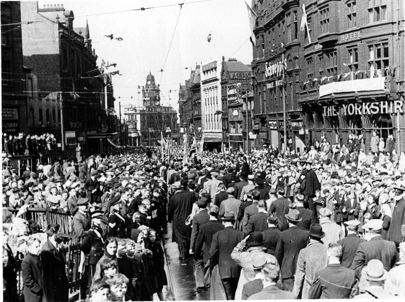 Thousands of people gathered at Fargate for a VE Day Victory Parade in 1945