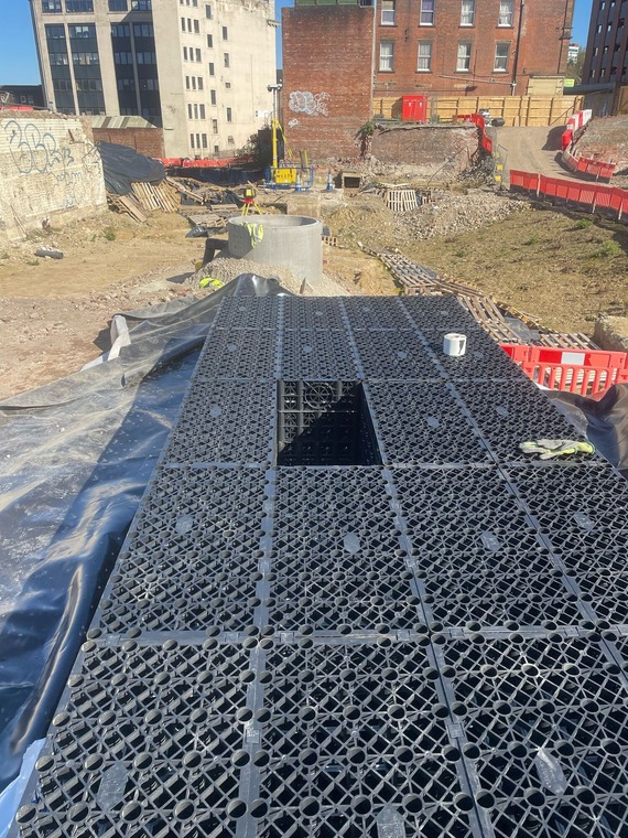 Attenuation tank being installed between two manhole chambers at Castlegate.