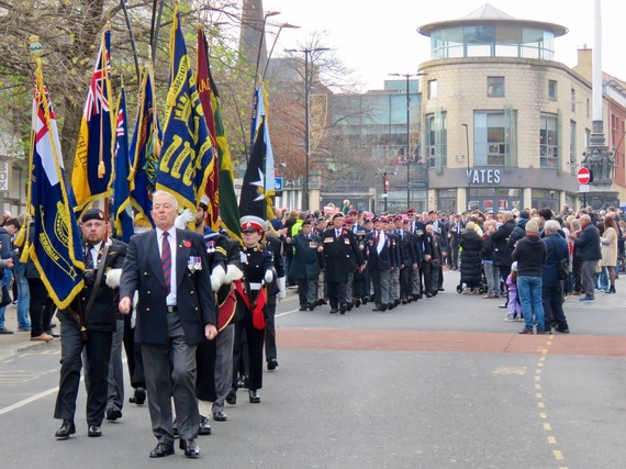 Members of the armed forces process from Barker's pool on Remembrance Sunday