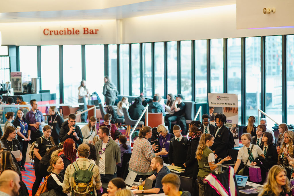 School students packing out a foyer at a creative careers fair.