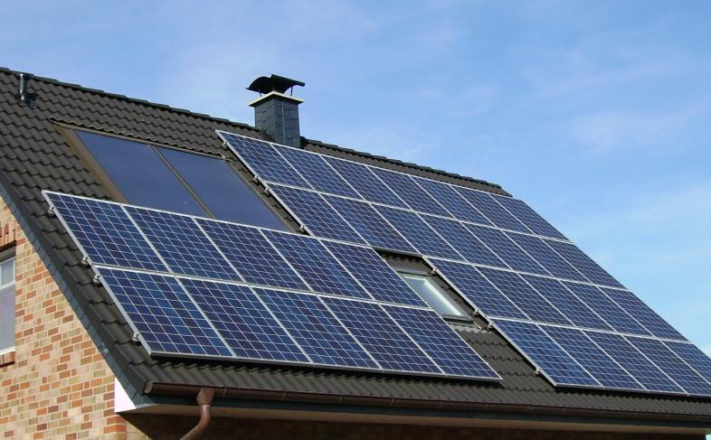 Solar panels on a tile roof on a sunny day