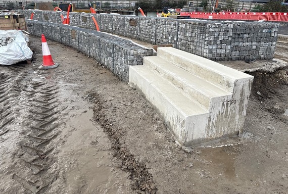 Gabion baskets and concrete steps adjacent to the bowling green
