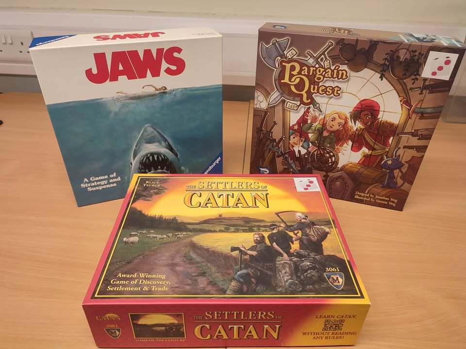 Three board games: Jaws, Bargain Quest and Settlers of Catan