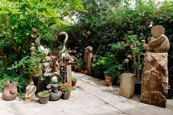 A leafy and summery sculpture garden.