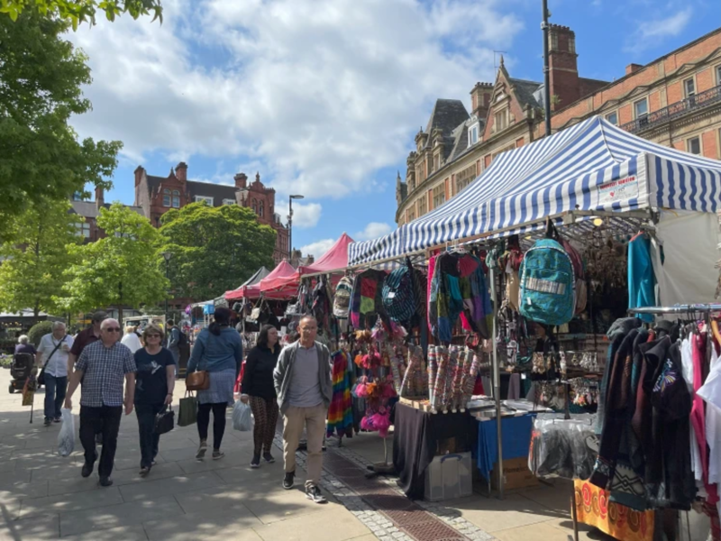 Stalls on Fargate, with a bright blue sky above it.