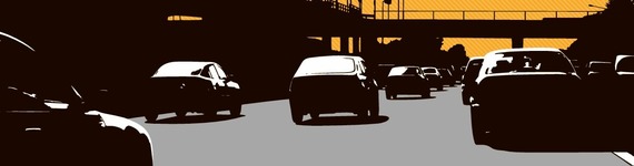 Silhouettes of cars driving on a motorway