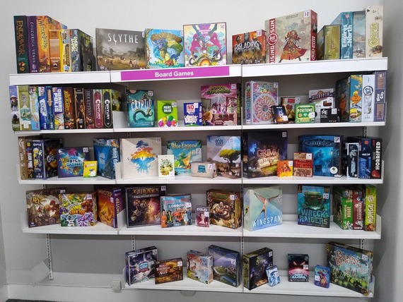 A photo showing the broad selection of board games on shelves in The Central Library