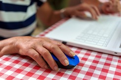 A hand using a computer mouse