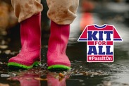 A pair of wellies in the rain with the 'kit for all' logo