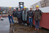 – Ian Best (left), Marie Bruhat (fifth from left) and Lee Coutts (right) with Parkol Marine Engineering staff in Whitby
