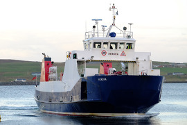 The MV Hendra - a blue and white ferry in Council livery, on the water