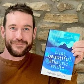 Malachy Tallack, holding his book