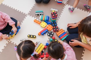 Children playing with brightly coloured toys
