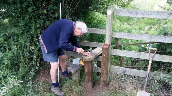 Peter James fixing a stile