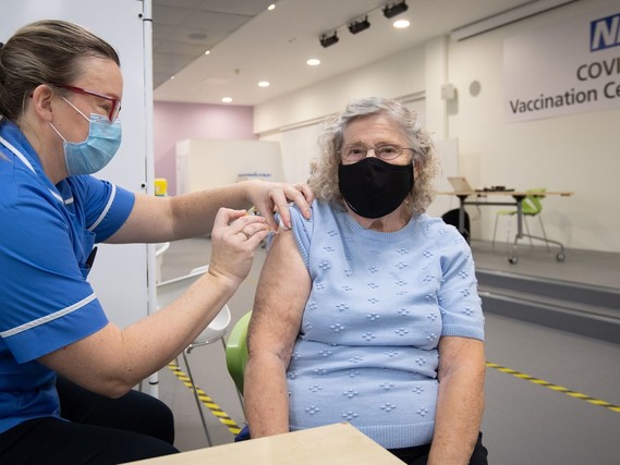 Person receiving Covid 19 vaccination 