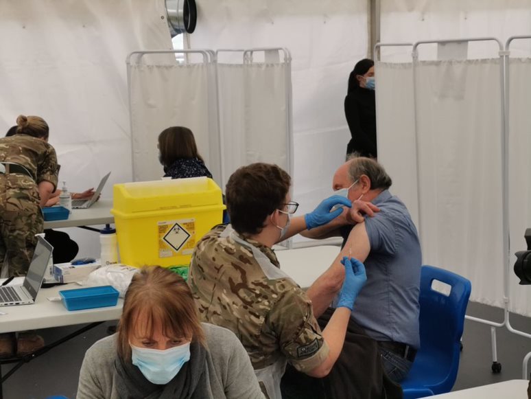Person being vaccinated at Ludlow Racecourse