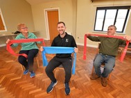 Taking part in a fitness class are Chris Ball, left and Rob Evans, right, with fitness instructor Dan Lewis, at Shrewsbury Baptist Church