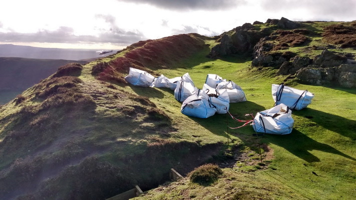 material in dumpy bags dropped by helicopter onto Caer Caradoc to repair the ramparts of the hillfort