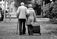 older couple walking in cold weather