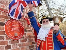 red plaque town crier