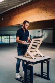 man standing at a desk