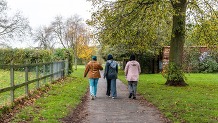 3 women walking in the countryside