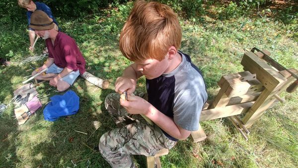 photo of young person whittling