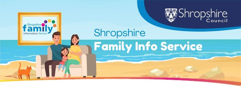 A family sitting on a sofa at the beach