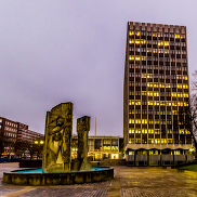 Civic Centre Building and fountain both lit up as the sun goes down.