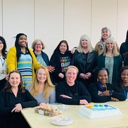 Some Southend Council foster carers, in front of a cake at the coffee morning event.
