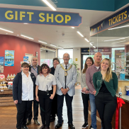 Mayor Ron Woodley and members of pier and Southend Council staff inside the new pier gift shop.