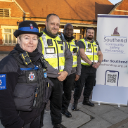 Three Transport Safety Officers with a police officer, in front of Southend Victoria Station.