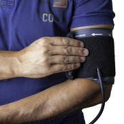 blood pressure cuff on arm
