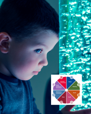 A child's profile against a blue bubble lamp.