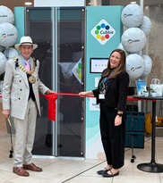 Launch event of the Cubbie, a sensory pod, featuring a red ribbon. Southend's major and a Bethan Mort are next to it.