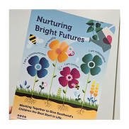 The cover of the Nurturing Bright Futures guide featuring a blue sky and colourful flowers.