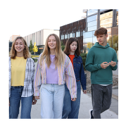 Young people walking outside a building.