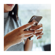 A close of hands holding a phone.