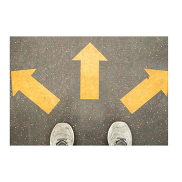 A pair on white trainers and three yellow arrow pointing at different directions