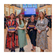 Ursula T, Samantha D, Louise C and Philomena J smiling to the camera while holding their SEND Award and certificates.