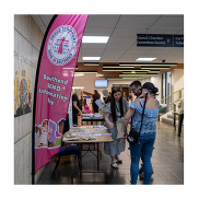 Southend SEND Information Day - Pink feather flag. Attendees at the event at talking to stallholders.